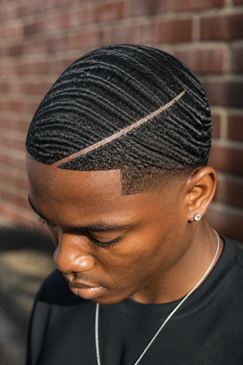 Man with 360 waves and a thin platinum slash at the hairline.