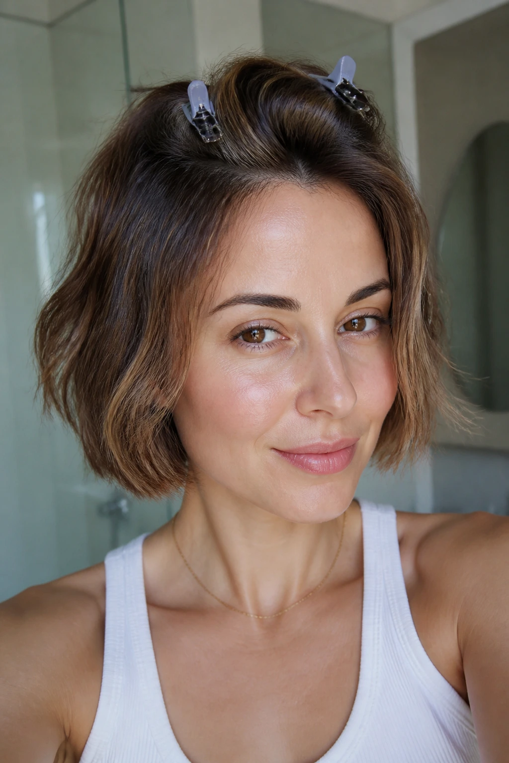 Close-up portrait of a real woman with an air-dried bob and crown clips
