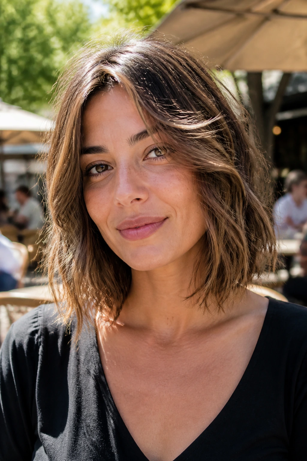 Real woman with an airy collarbone lob hairstyle outdoors