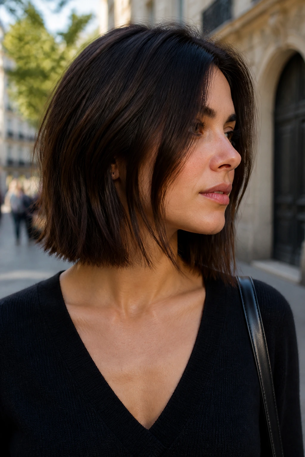 Portrait of a woman with an angled lob skimming past the jawline.