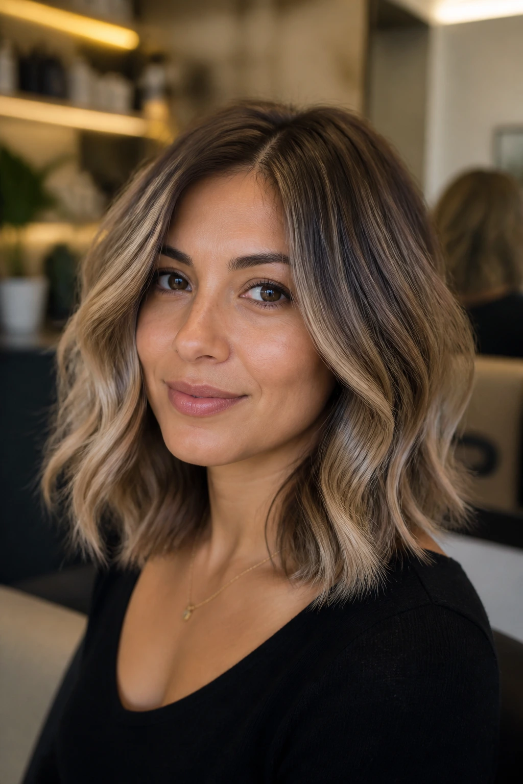 Close-up portrait showing beige-ash balayage with soft root shadow for undertone matching