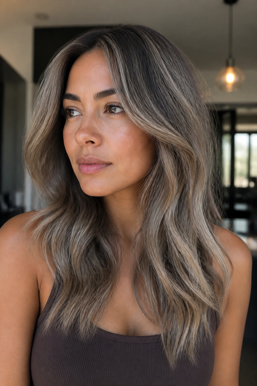 Portrait of a person with ash beige pearl mushroom toned hair.