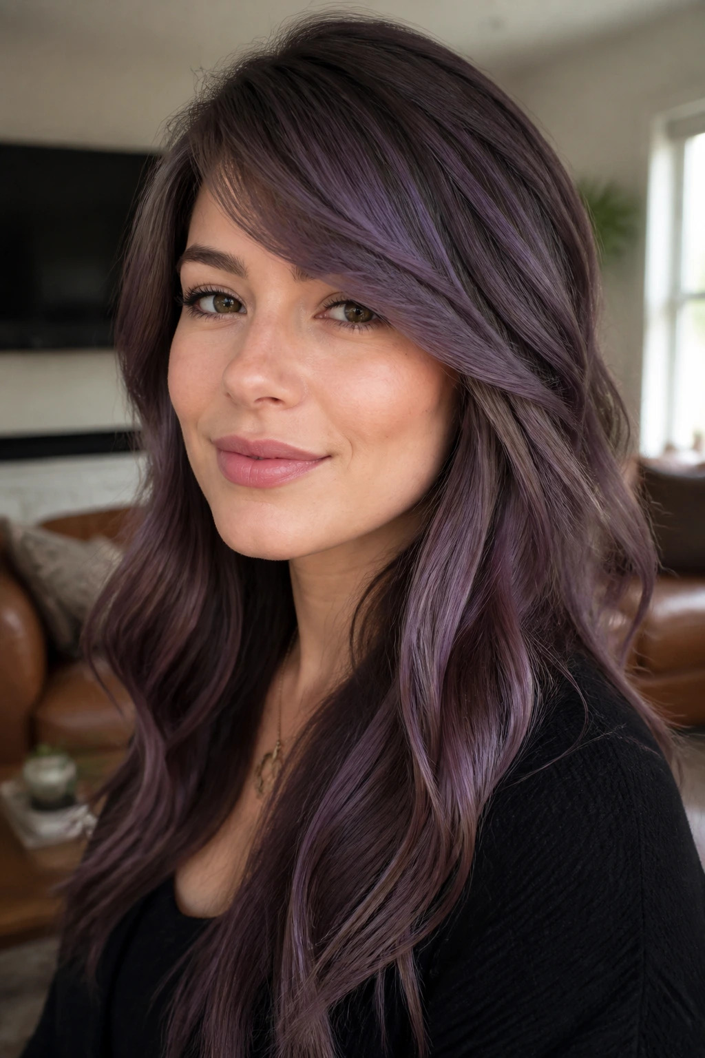 Close-up of a real woman with brunette base and lilac tones with side-swept bangs