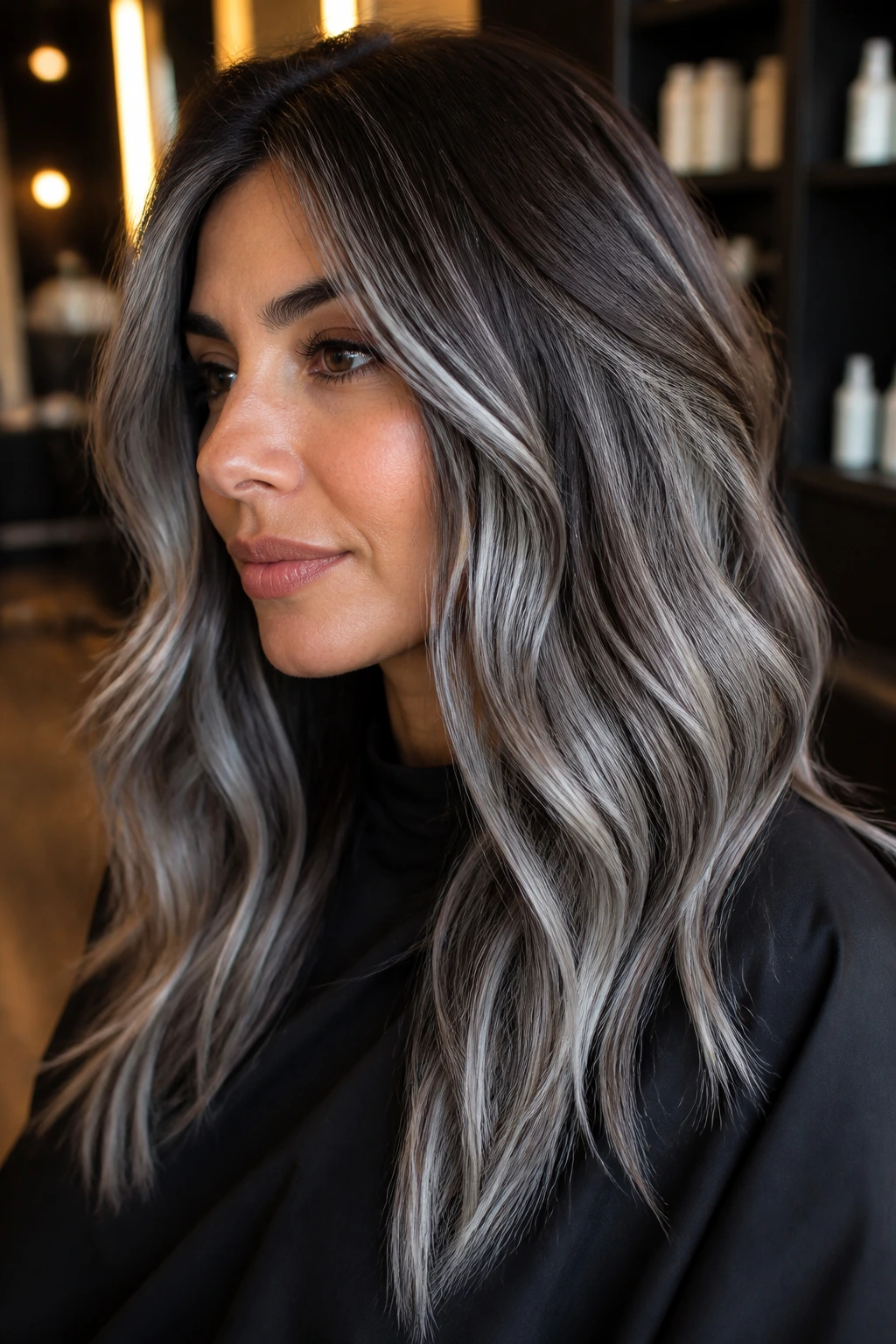 Close-up of olive-skinned person with dimensional silver balayage