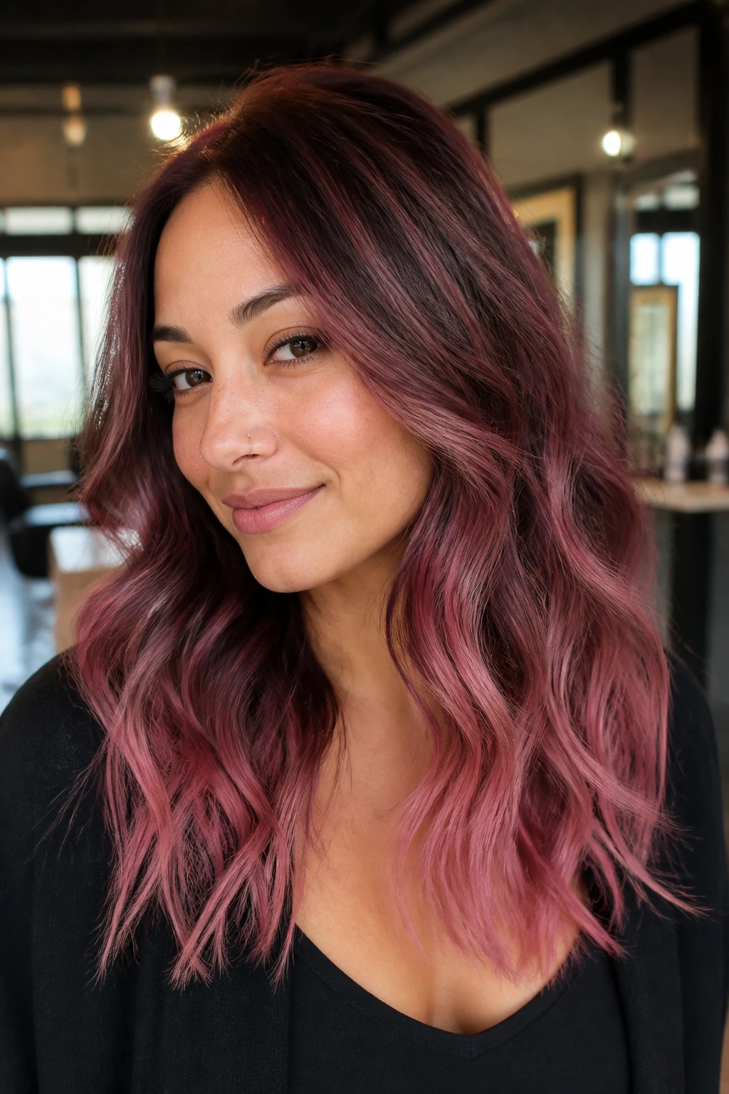 Real woman with berry dust lowlights and pink ends in soft light