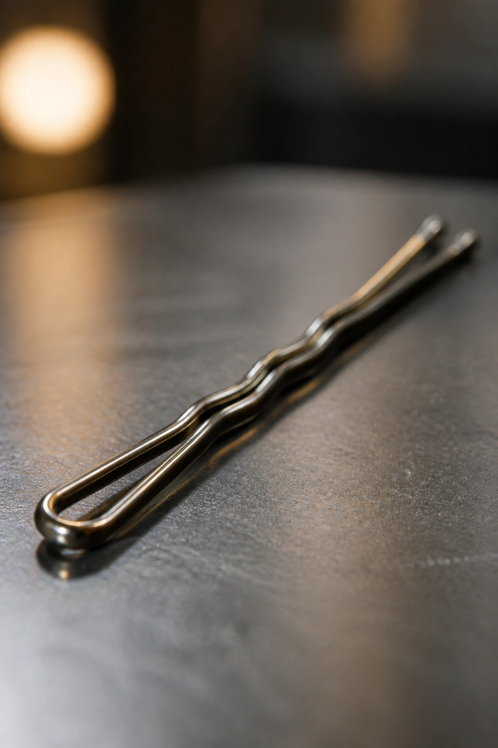 Macro close-up of a long bobby pin in a salon setting