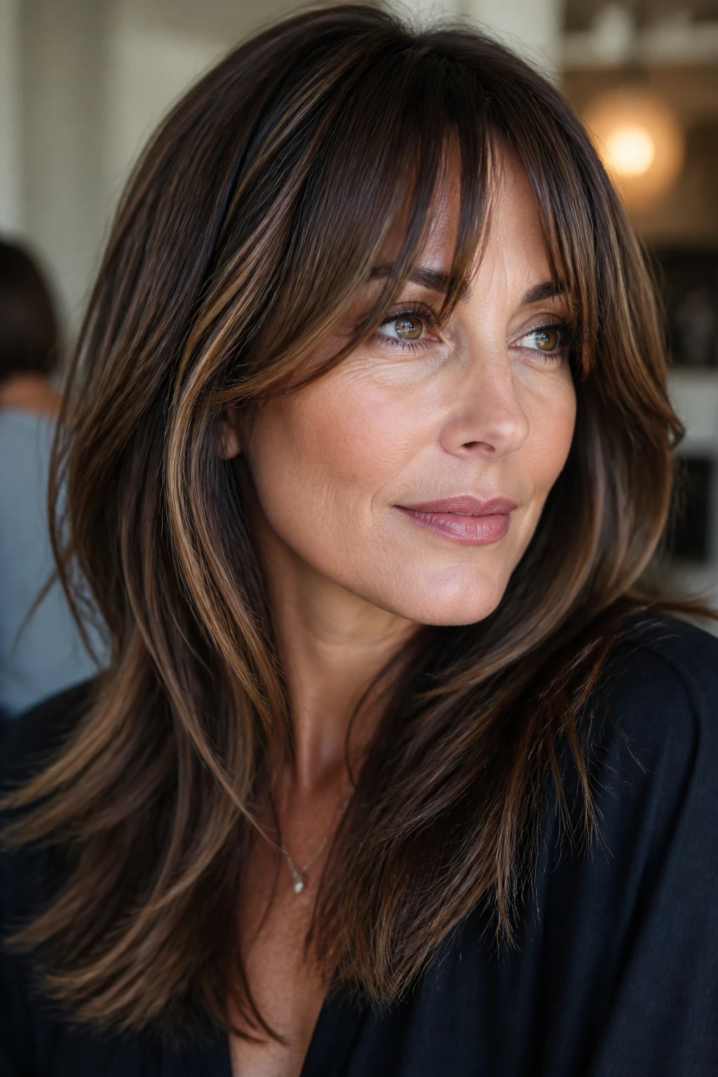 Close-up portrait of a real woman with bottleneck bangs and mocha ribbons