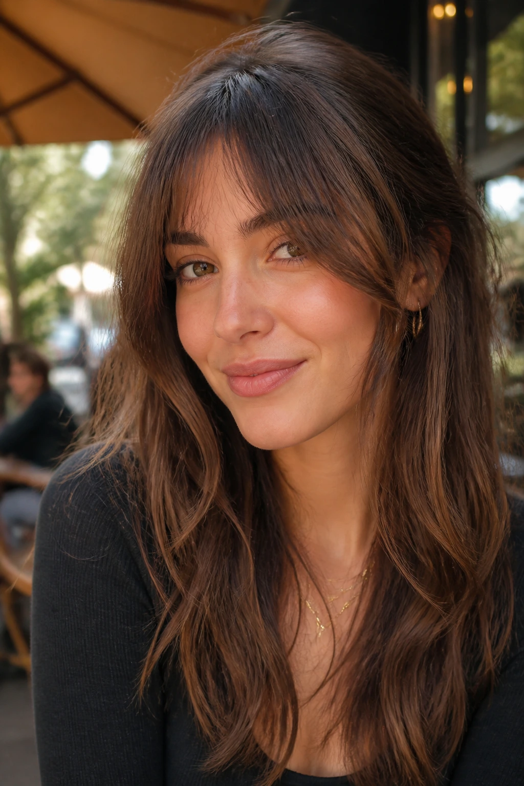 Close-up of a real woman with bottleneck bangs showing a slimmer center