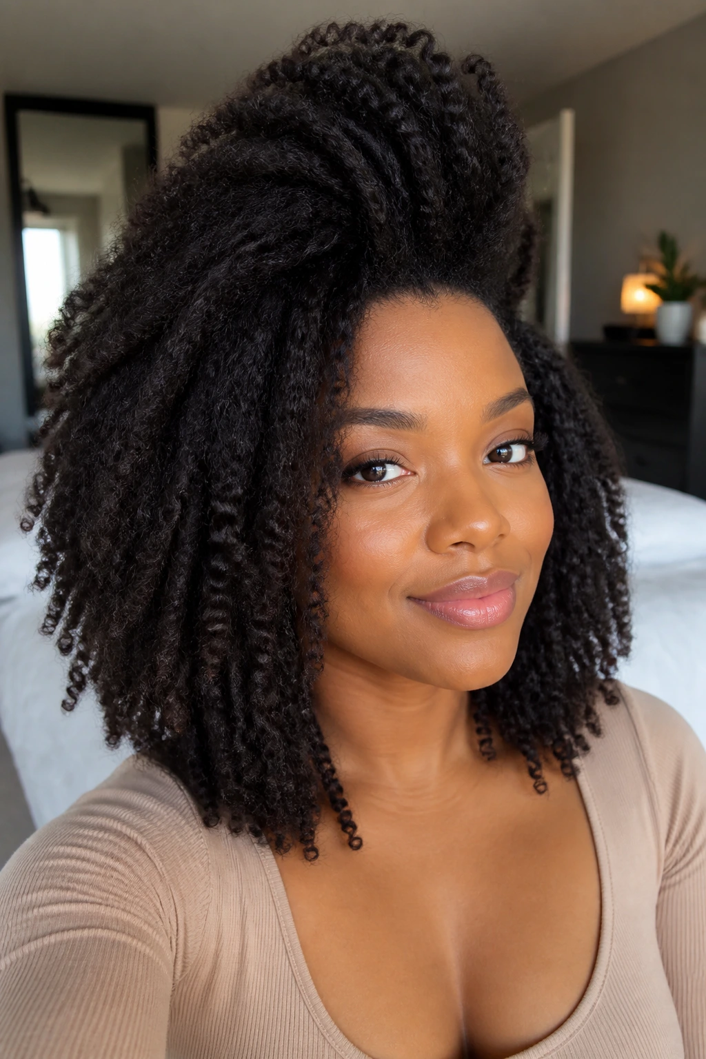 Woman with stretched braid-out and lifted roots, portrait shot