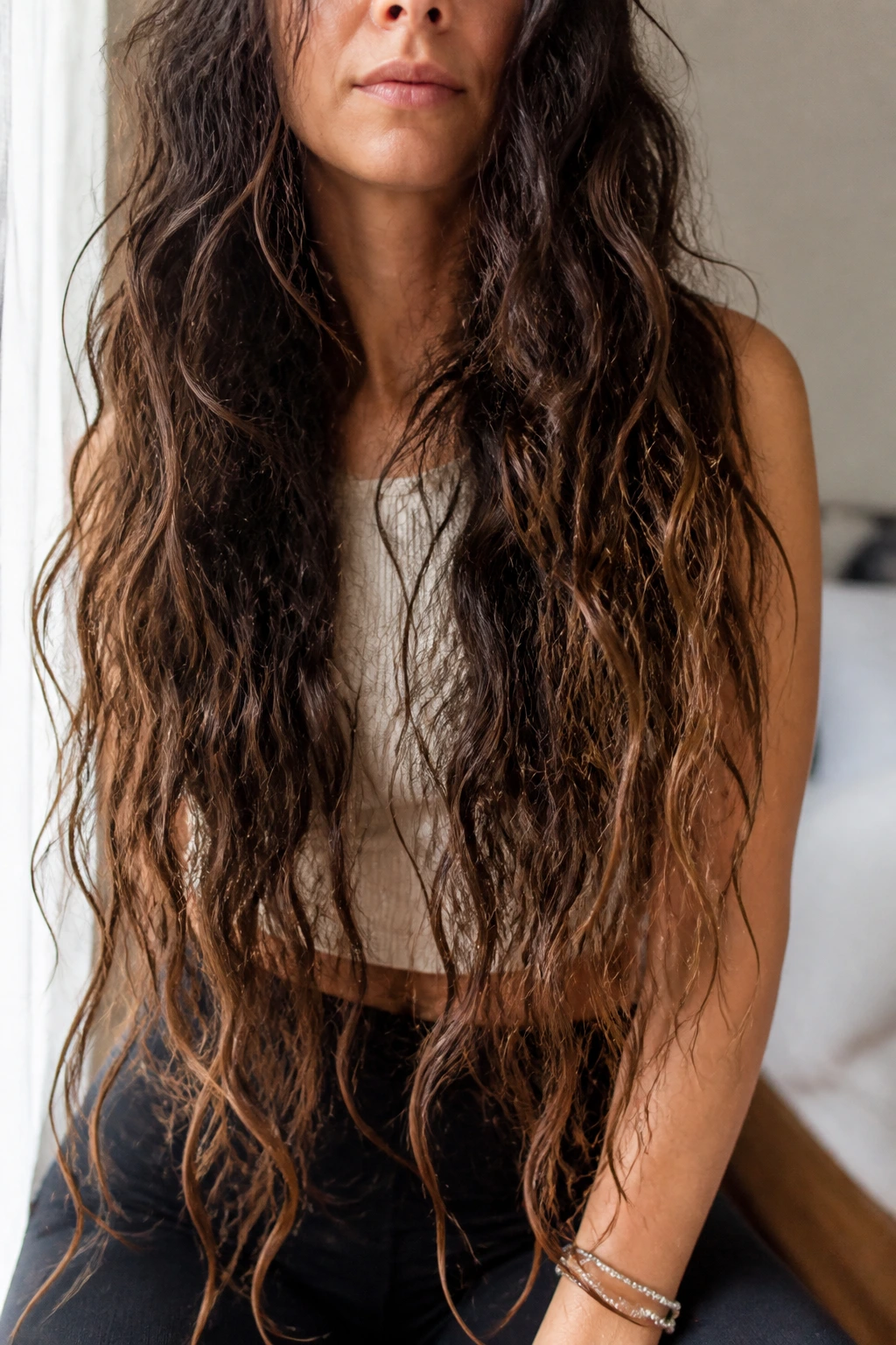 Close-up of long curls with broken mermaid ends for texture