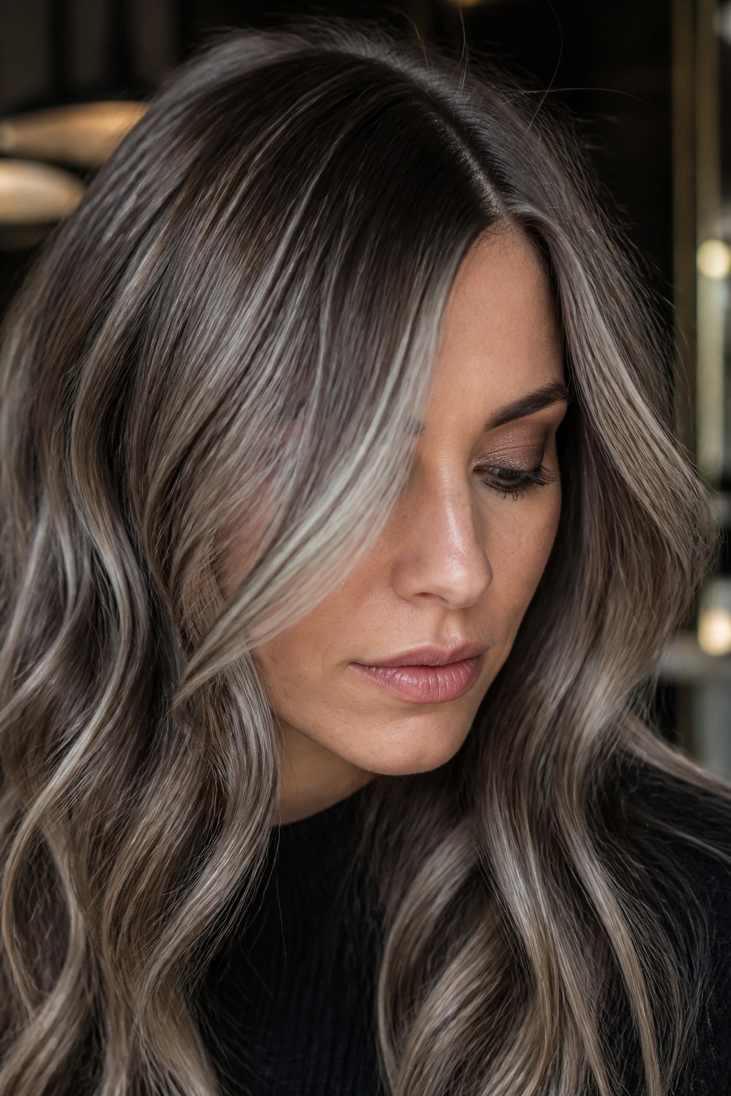Close-up portrait of a real woman with smoky bronde and silver veil on hair