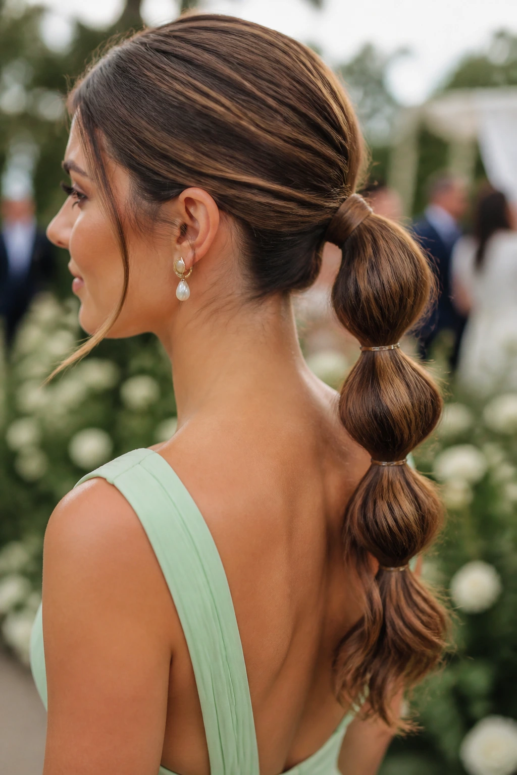 Close-up of a real woman with a bubble braid ponytail