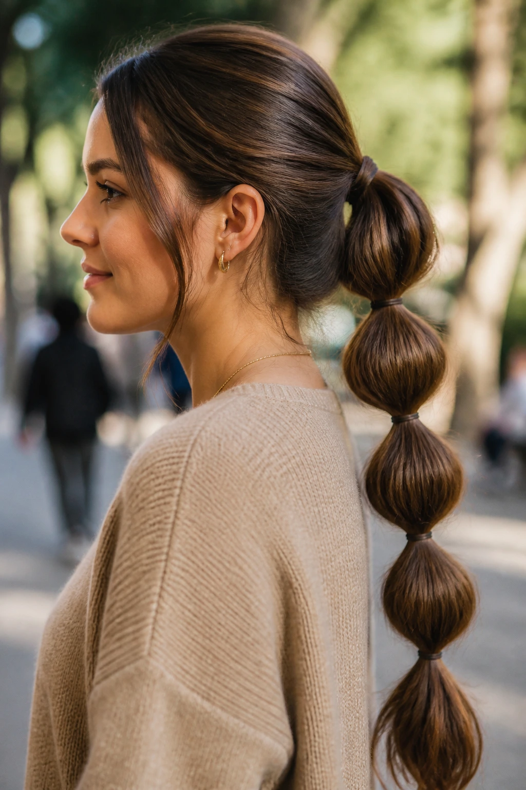 Portrait of a woman with a bubble ponytail on thick hair