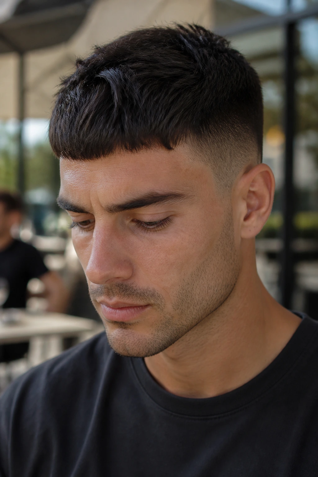 Portrait of a man with Caesar haircut and forward fringe