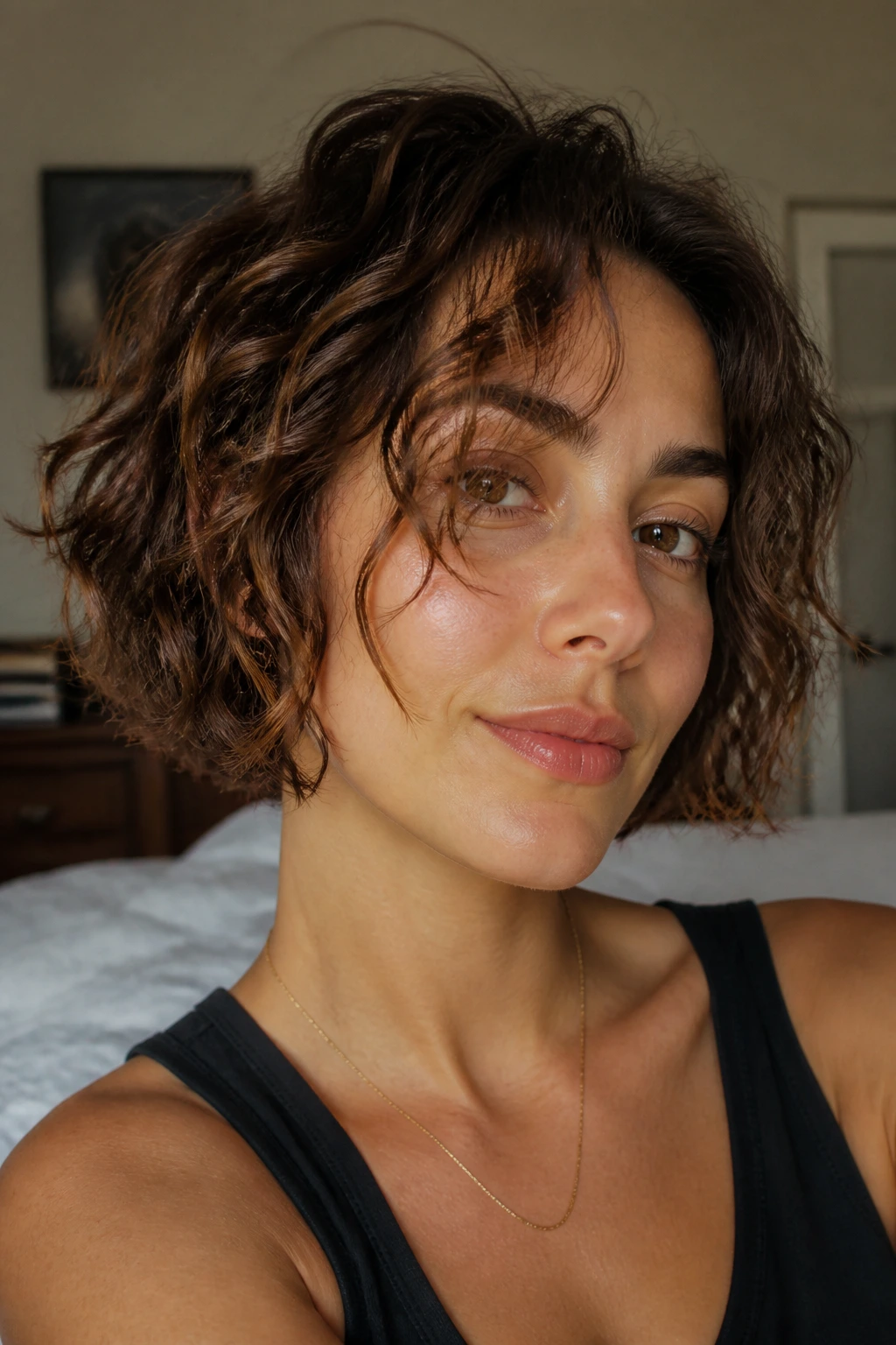 Portrait of a real woman with chin-length crop and piecey ends in daylight