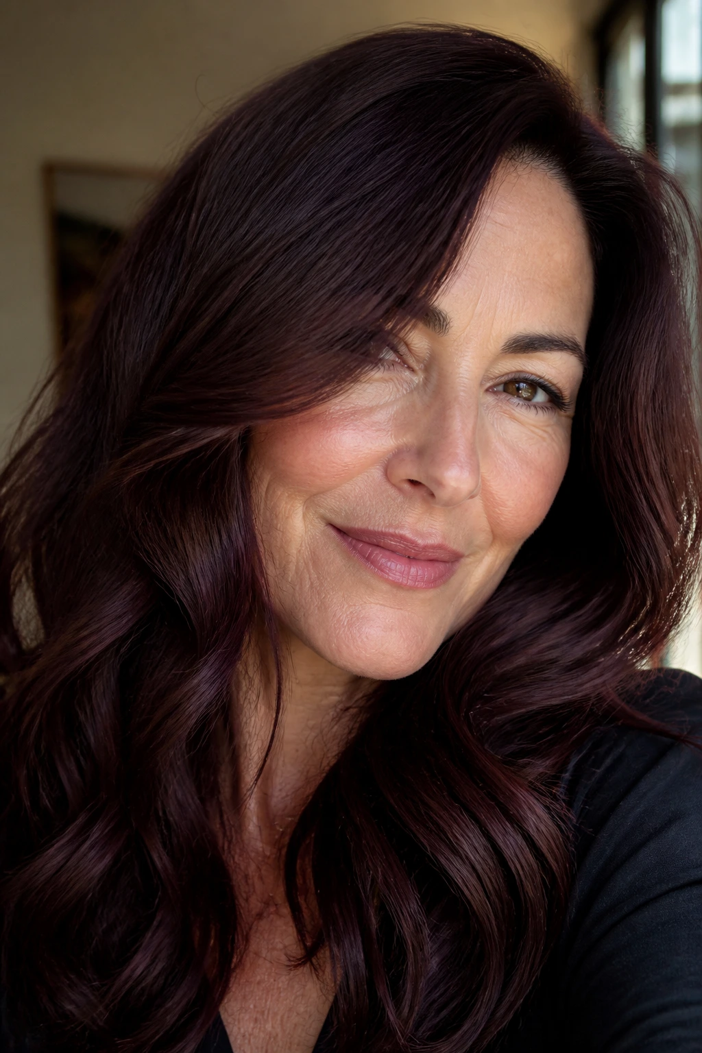 Real woman with chocolate cherry brown hair with red-violet undertones