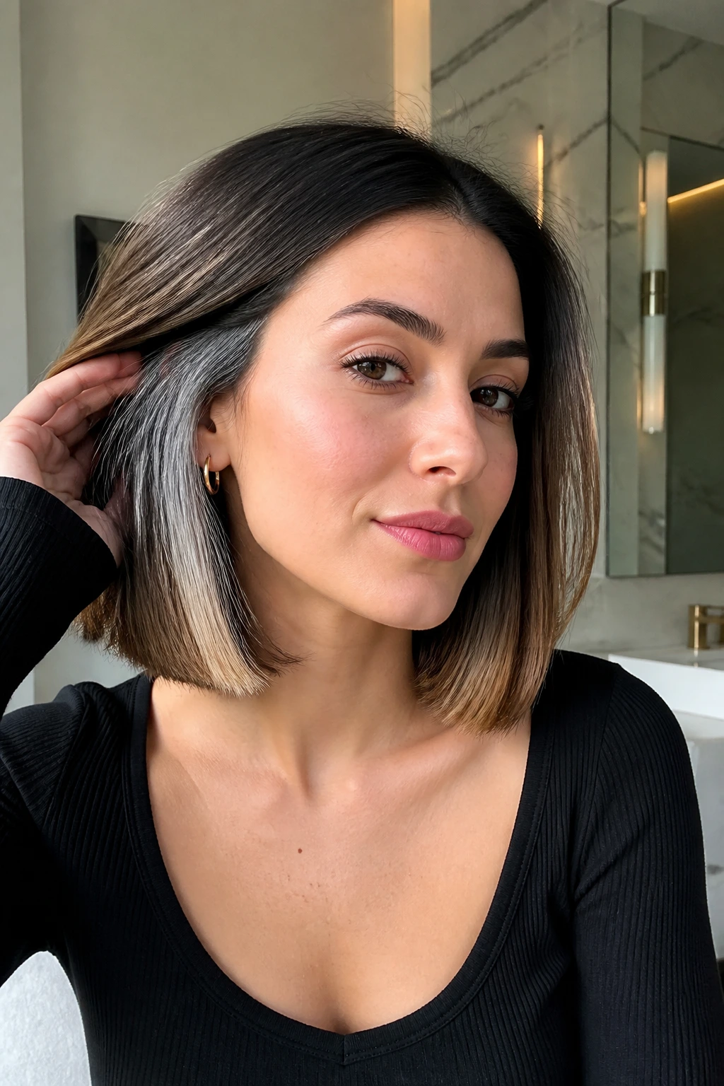 Portrait of a real woman with collarbone blunt cut and grey underlights.