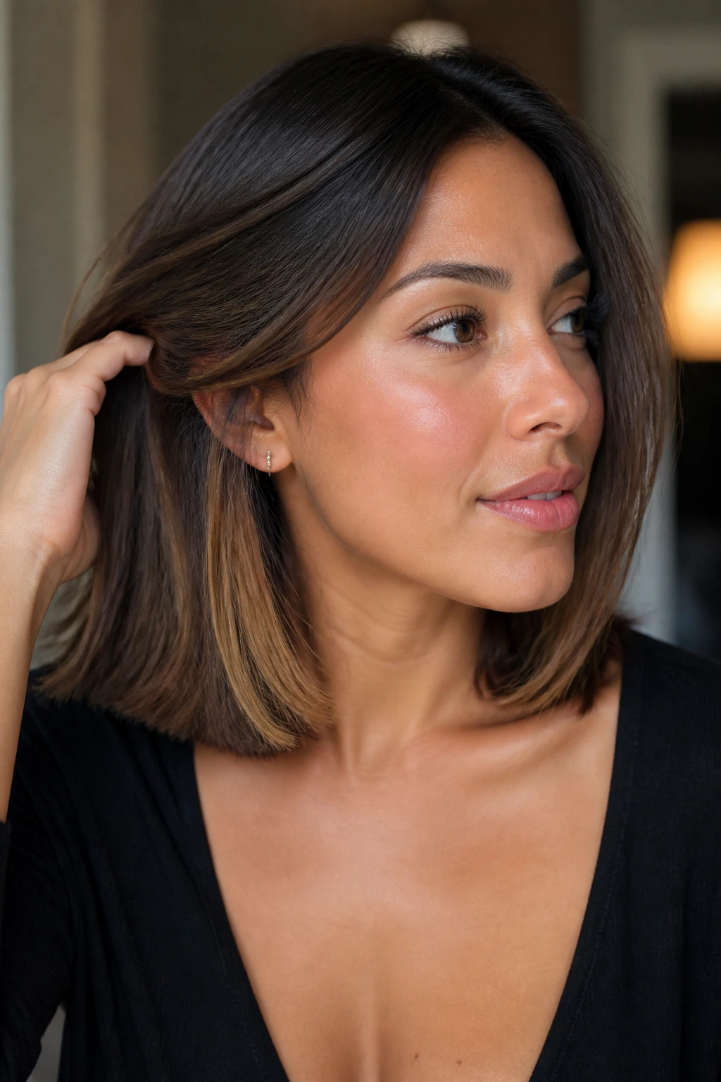 Real woman with collarbone-length hair showing hidden caramel panels