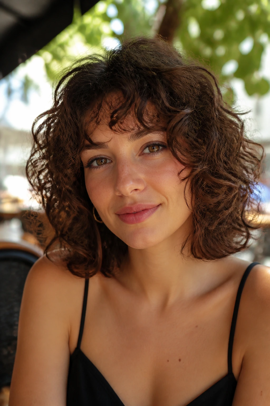 Close-up portrait of a real person with collarbone-length hair and flipped ends.
