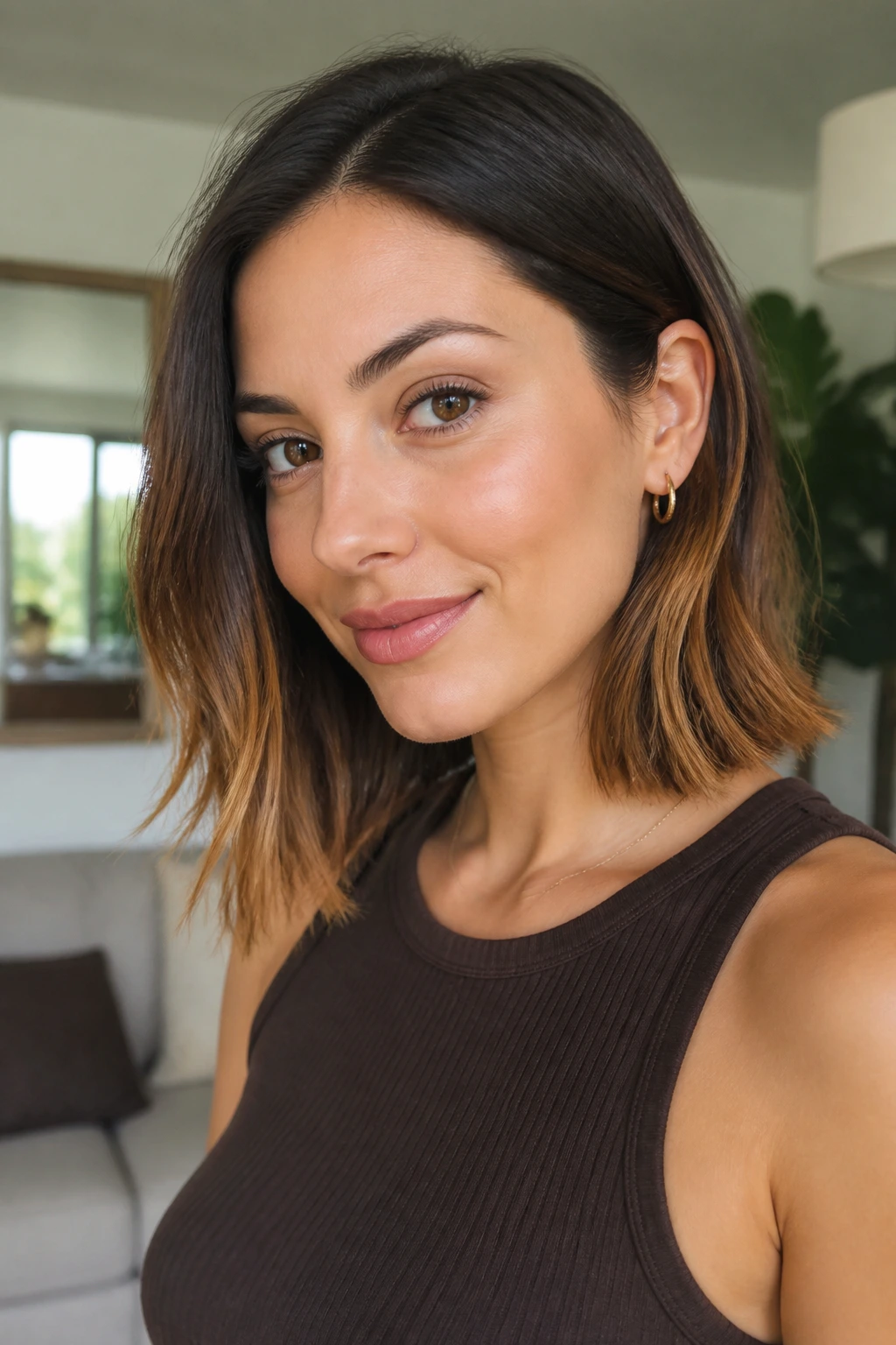 Collarbone-length lob with strawberry blonde ends on dark hair