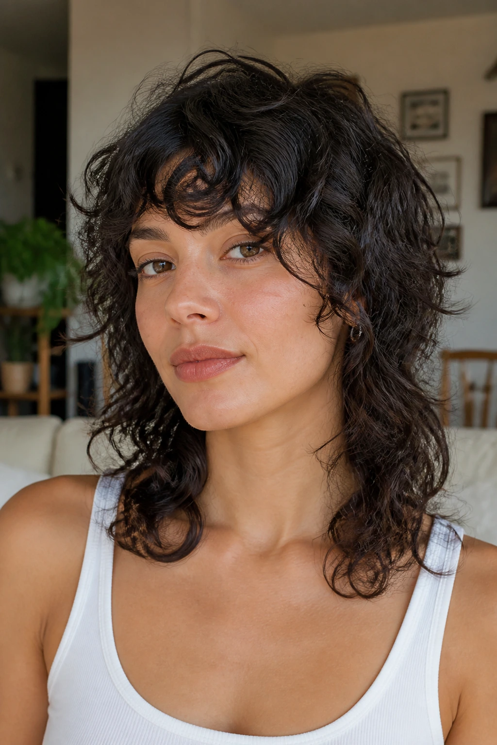 Portrait of a real person with a collarbone-length wolf-influenced shag and side bangs.