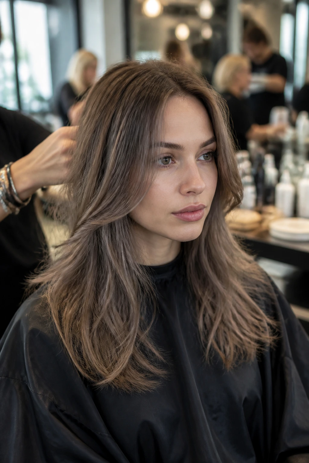 Portrait of a person in a busy salon with cool brown hair