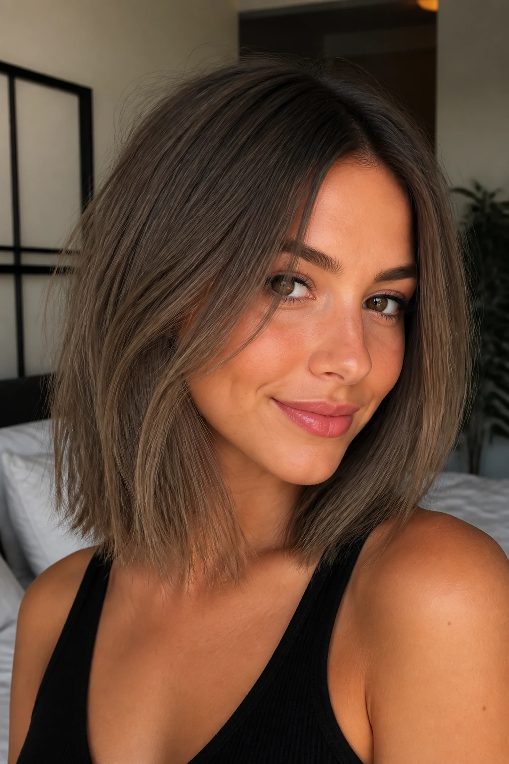 Brunette with cool mocha lob, soft waves, framing the face