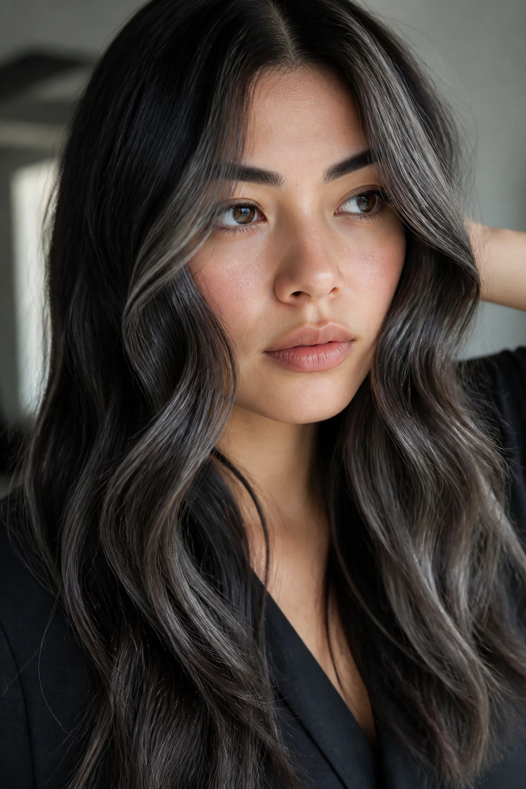 Portrait of a person with cool-toned grey balayage shades