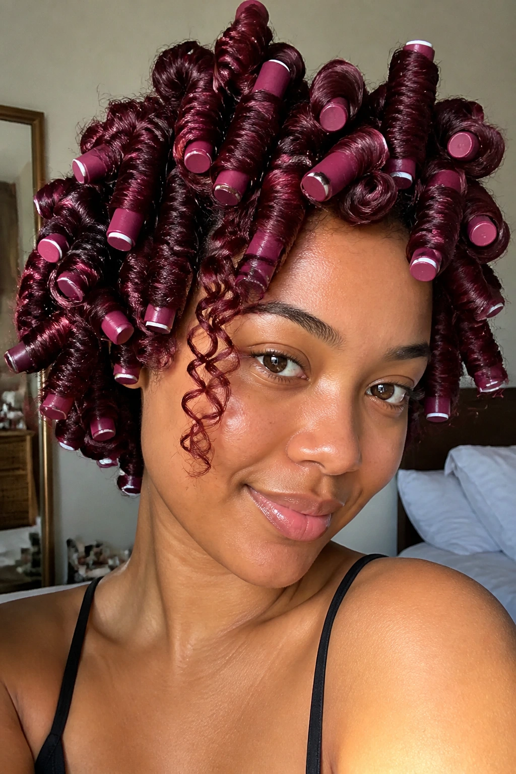 Close-up of a woman with cranberry-colored flexi-rod curls