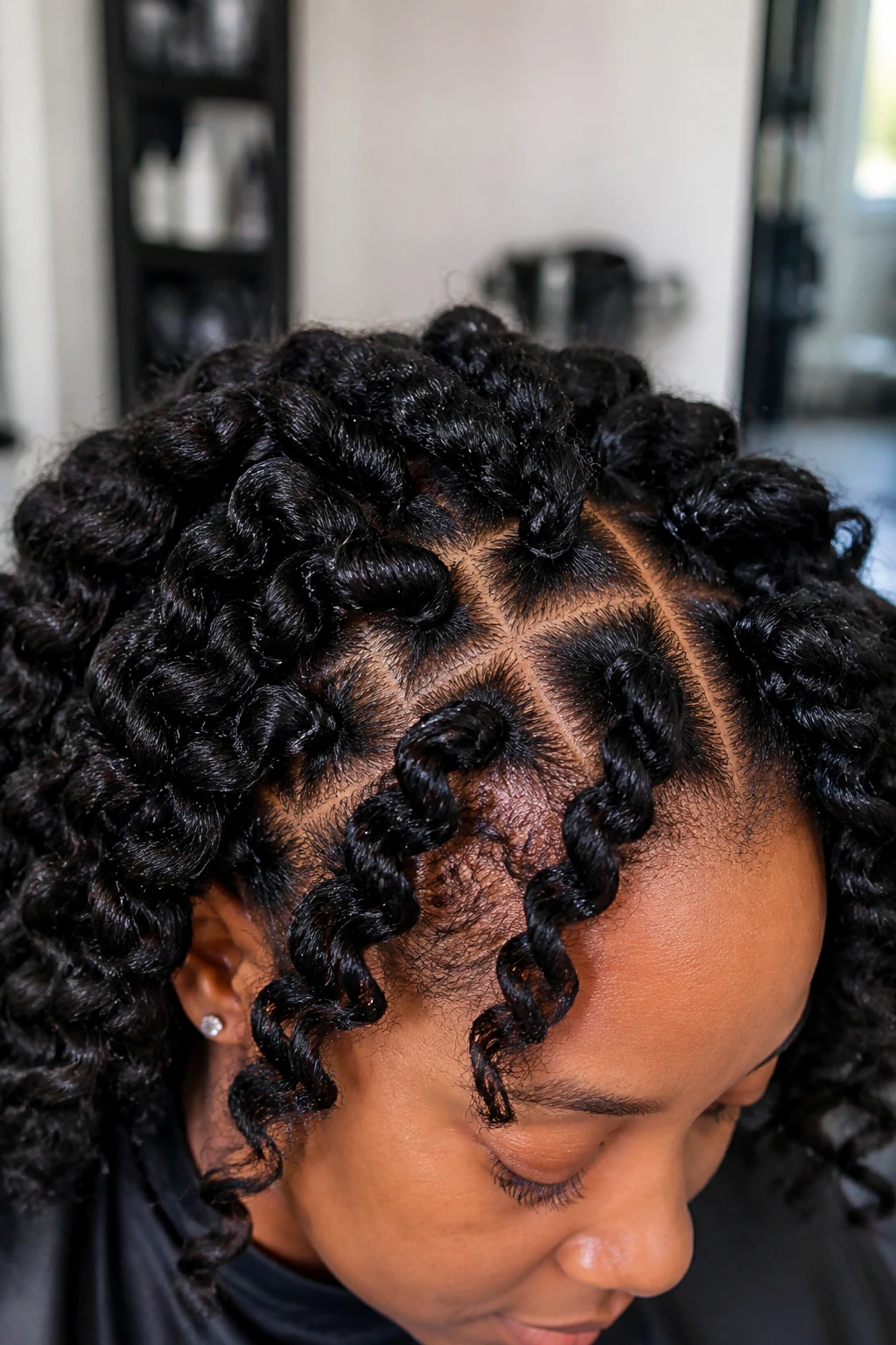 Close-up of crochet-inspired chunky curls on a real person's crown