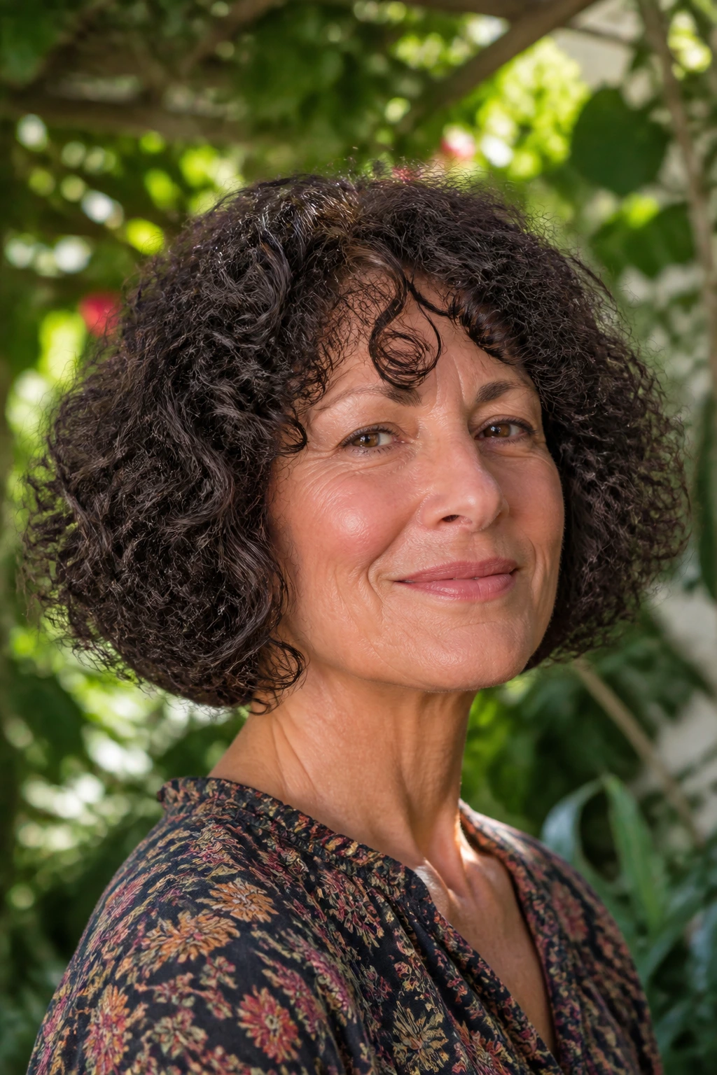 Portrait of a real woman with curly bob following curl pattern