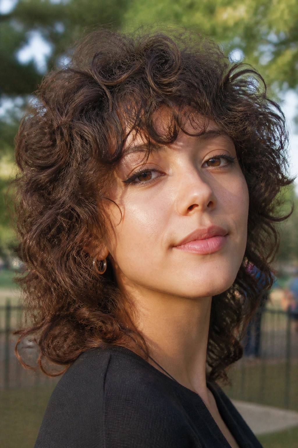 Portrait of a real person with curly shag and airy bangs in natural light