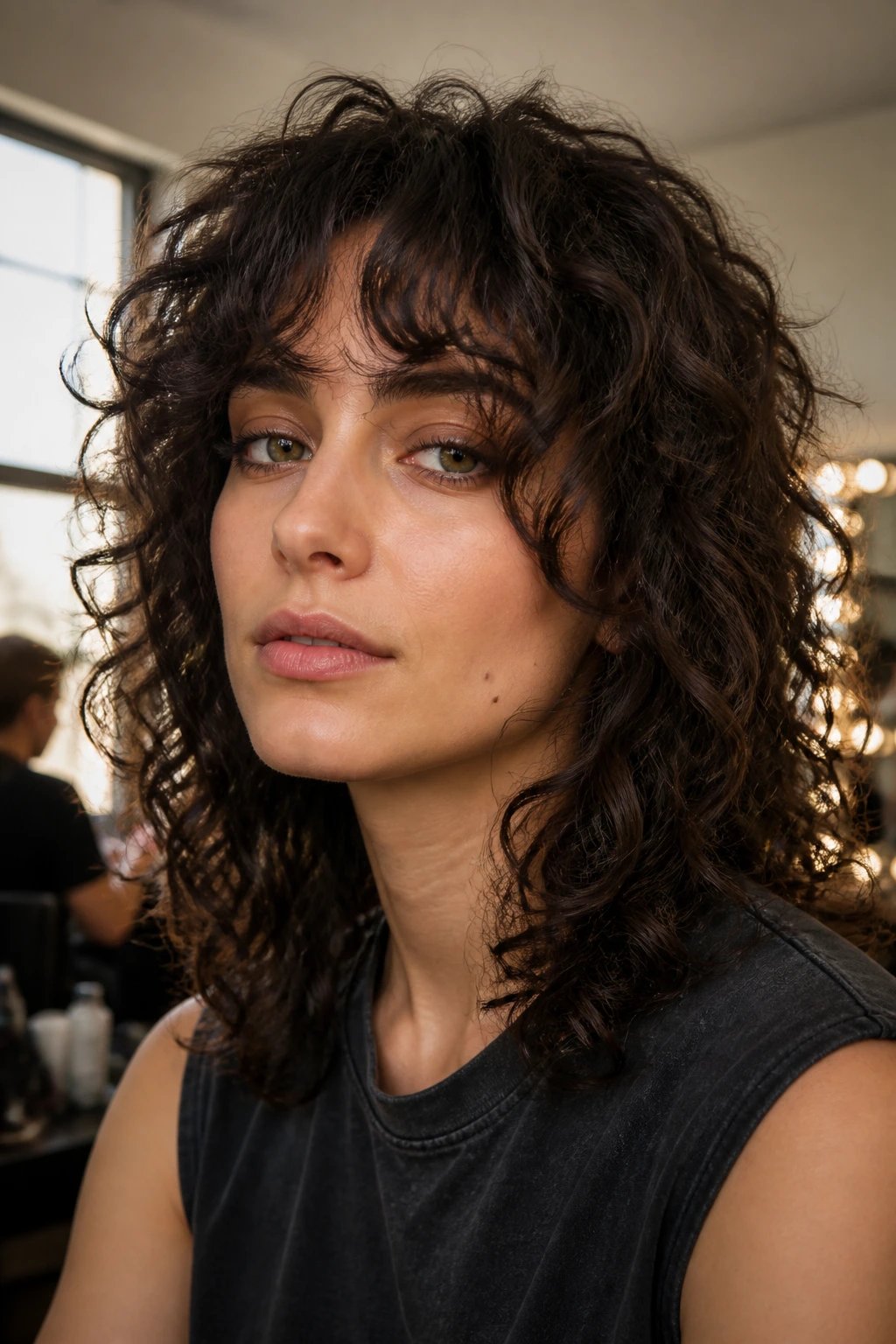 Close-up of a real person wearing a soft curly shag with curtain fringe