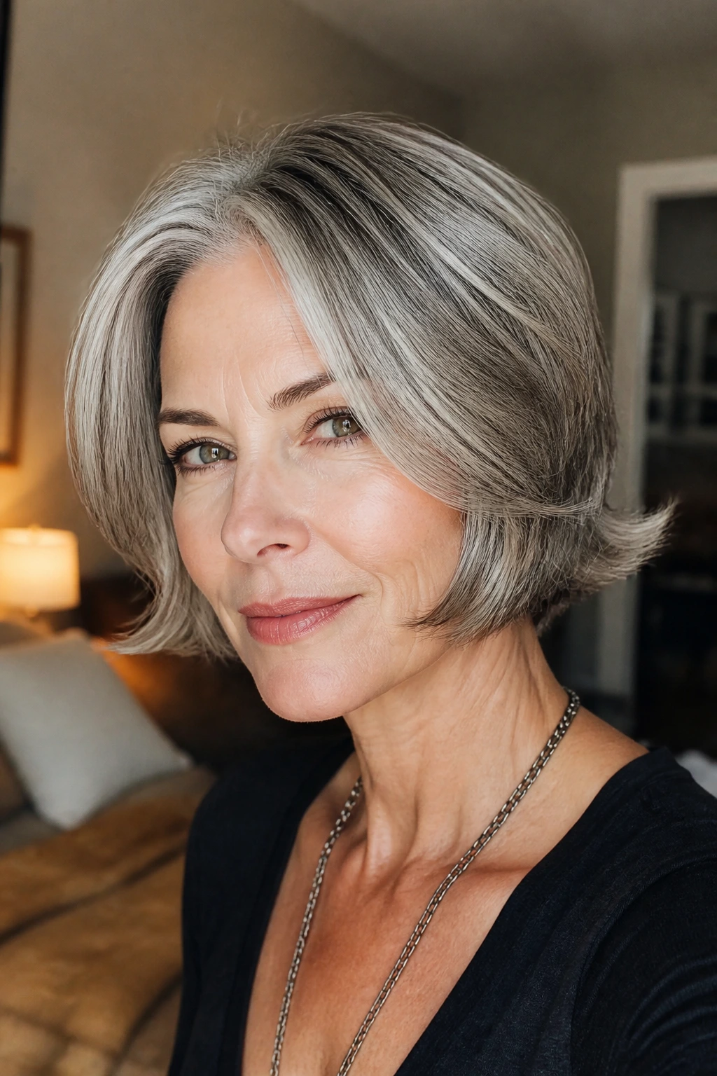 Close-up portrait of a real woman with a curved bob and outward flick at the ends