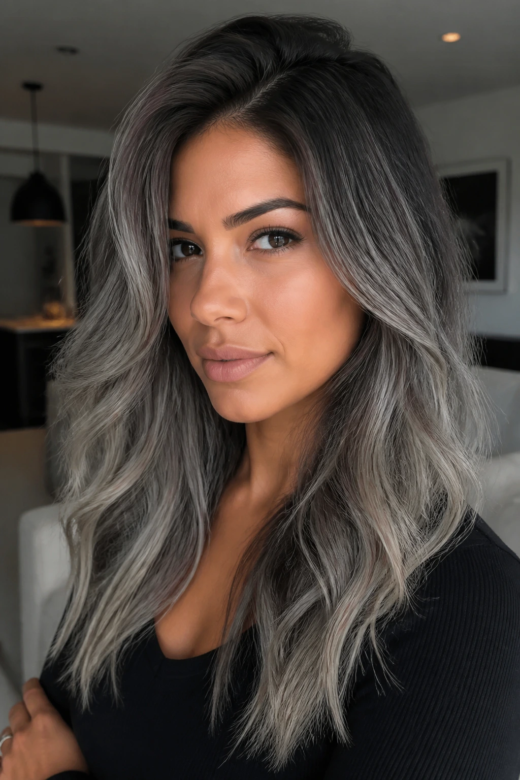 Deep charcoal shadow root hairstyle on a real person