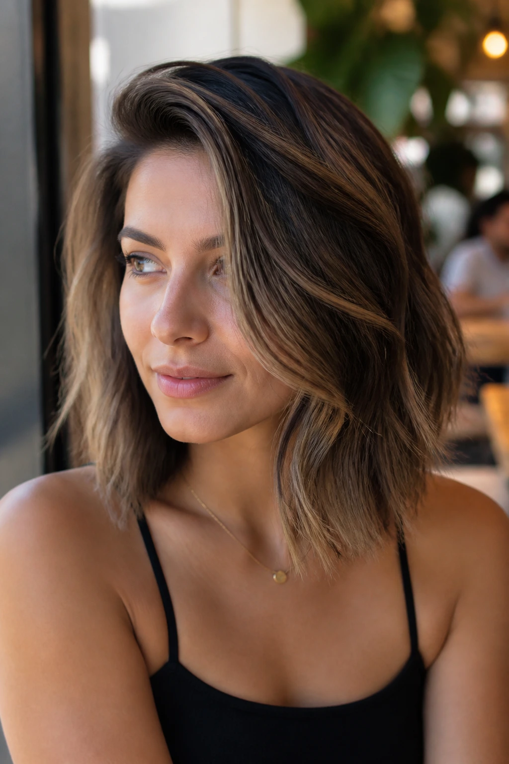 Close-up of deep side-part lob with waves and dark underpart for depth.