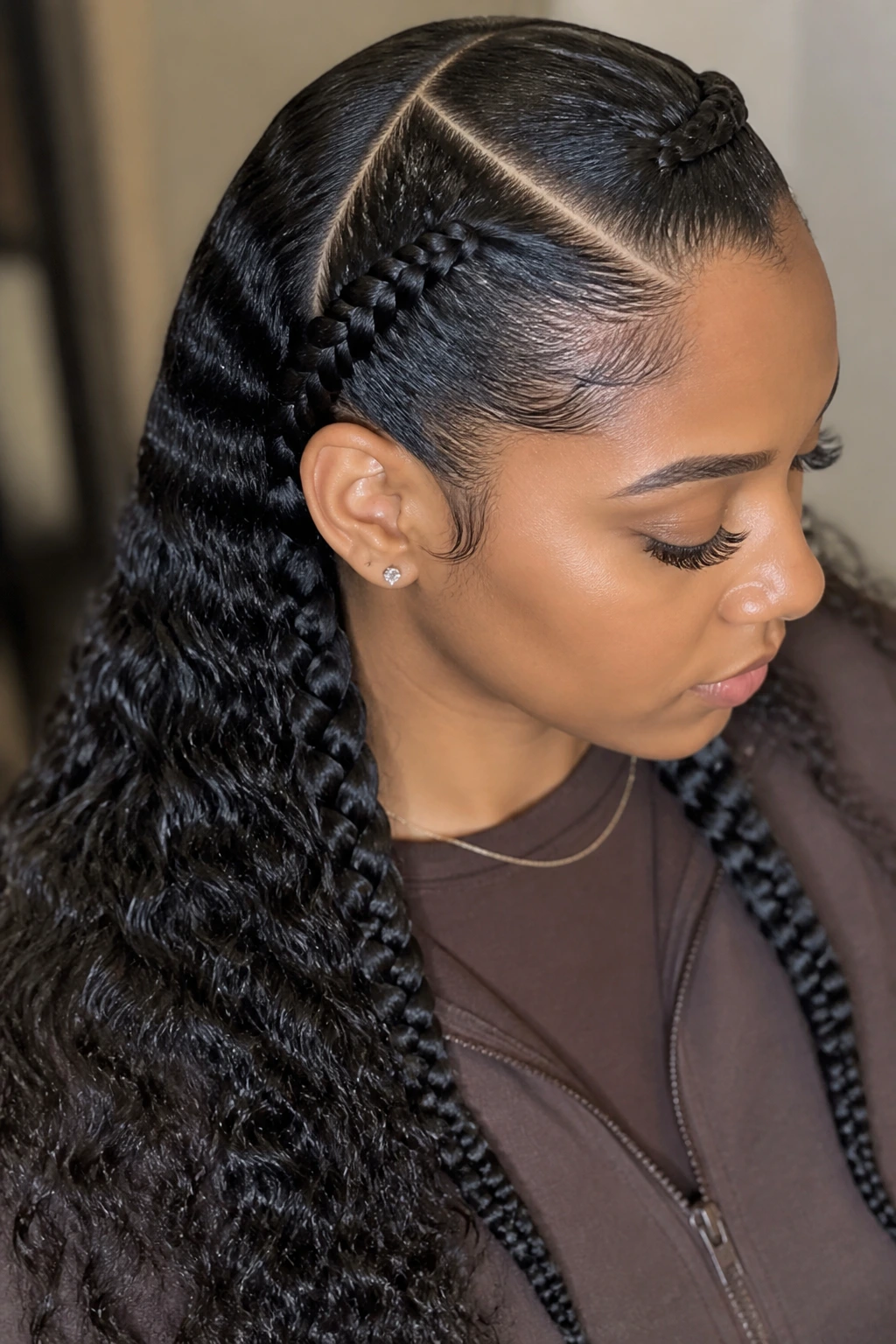 Close-up of a real Black woman with a deep side-part and double Dutch braids