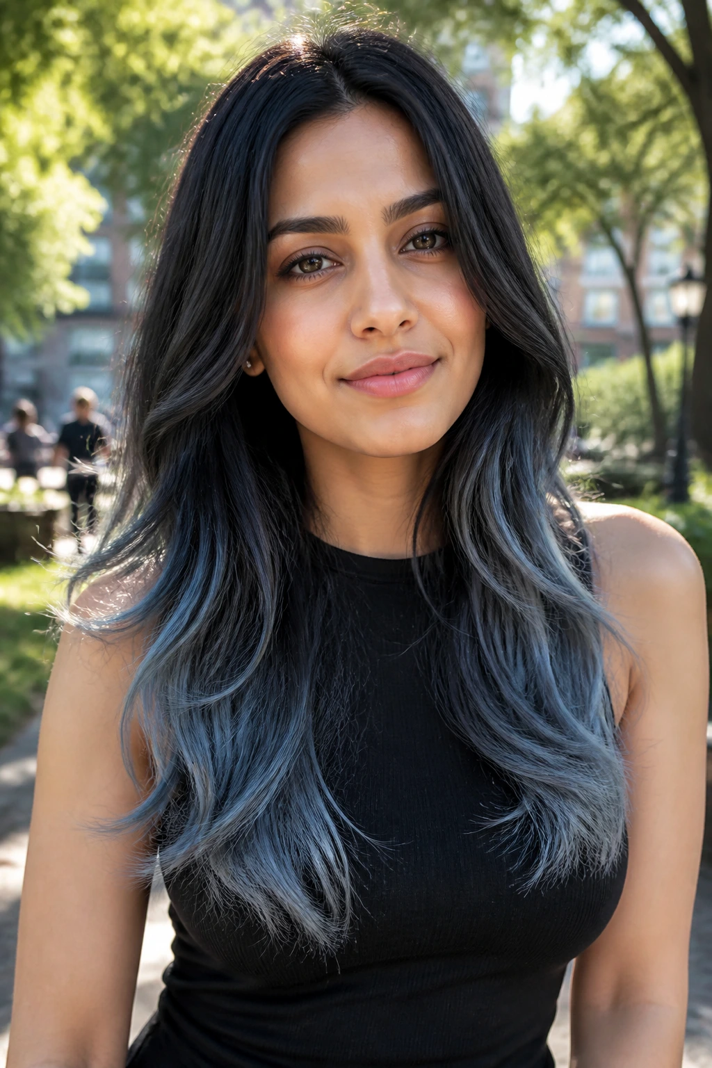 Portrait of a person with denim grey ends on long hair in an outdoor park.