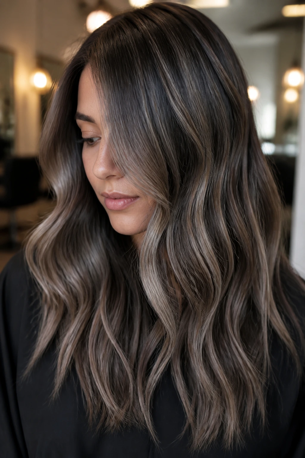 Close-up portrait of a person with dimensional greige balayage