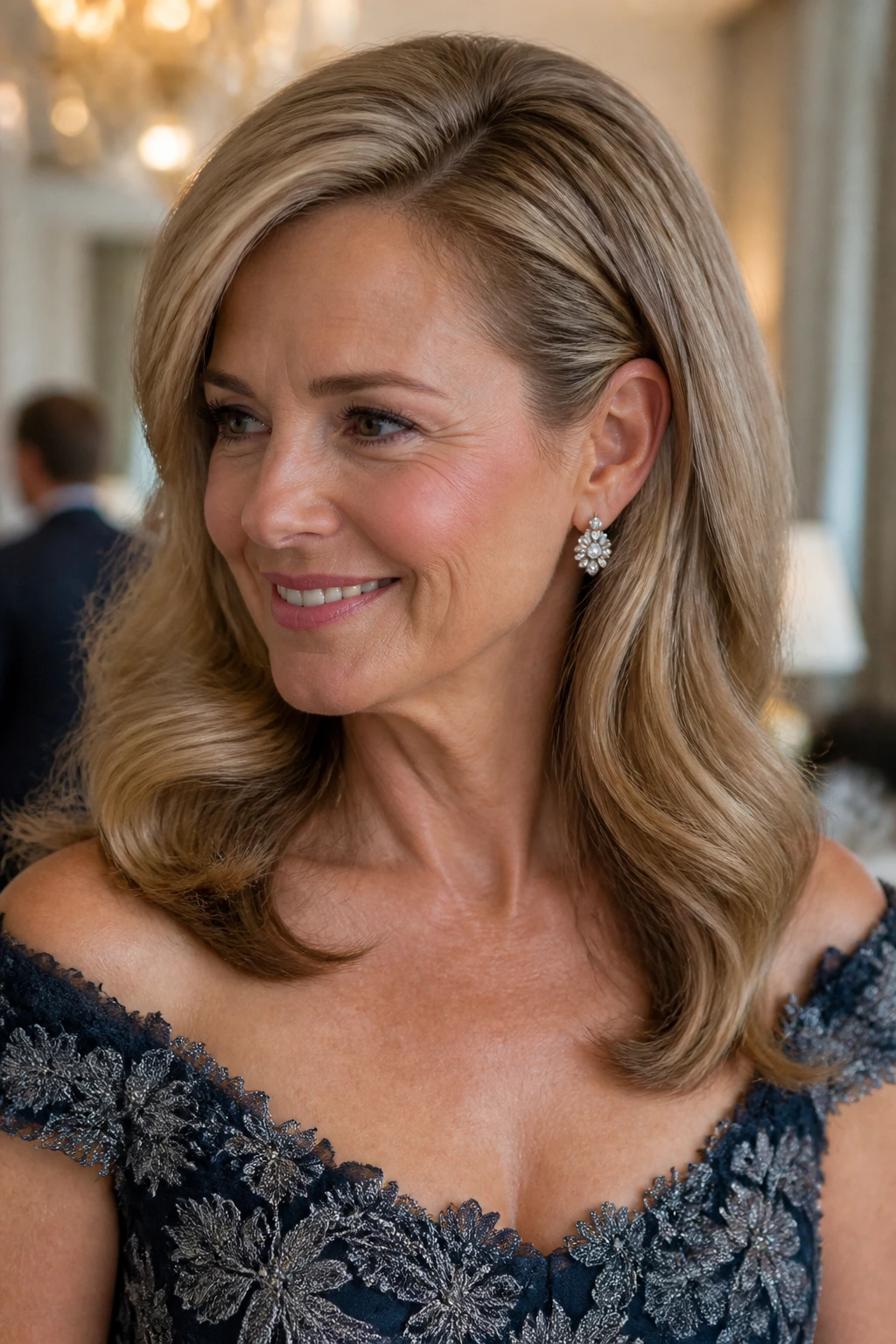 Close-up of a real woman with an elegant blowout and side tuck behind the ear