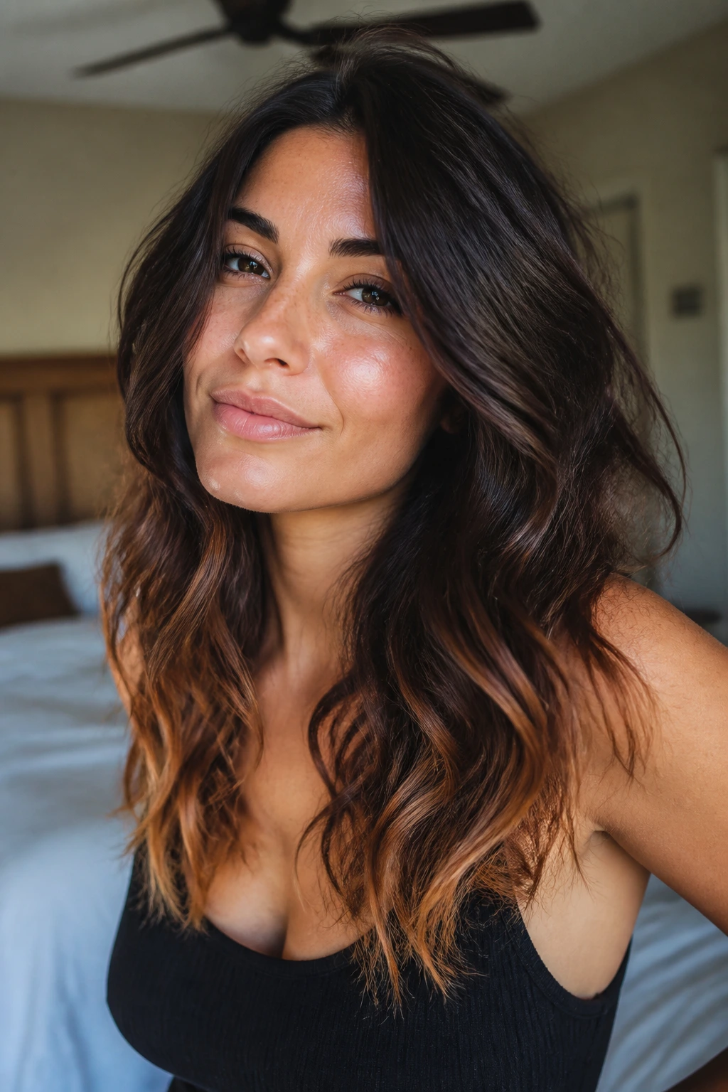 Espresso-dark hair with golden strawberry tips in tousled waves.