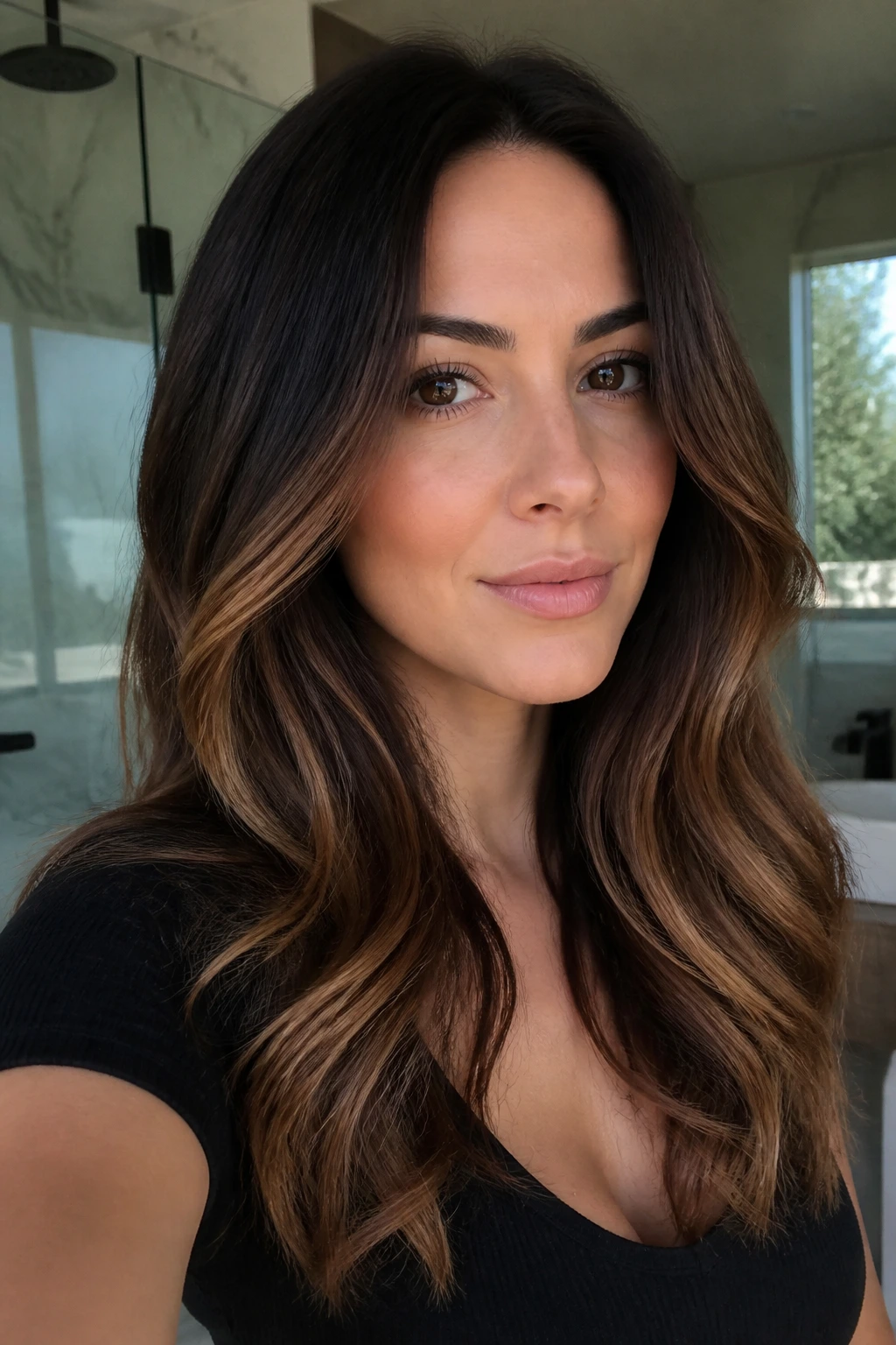 Close-up of brunette with espresso root melt transitioning to brown ribbons