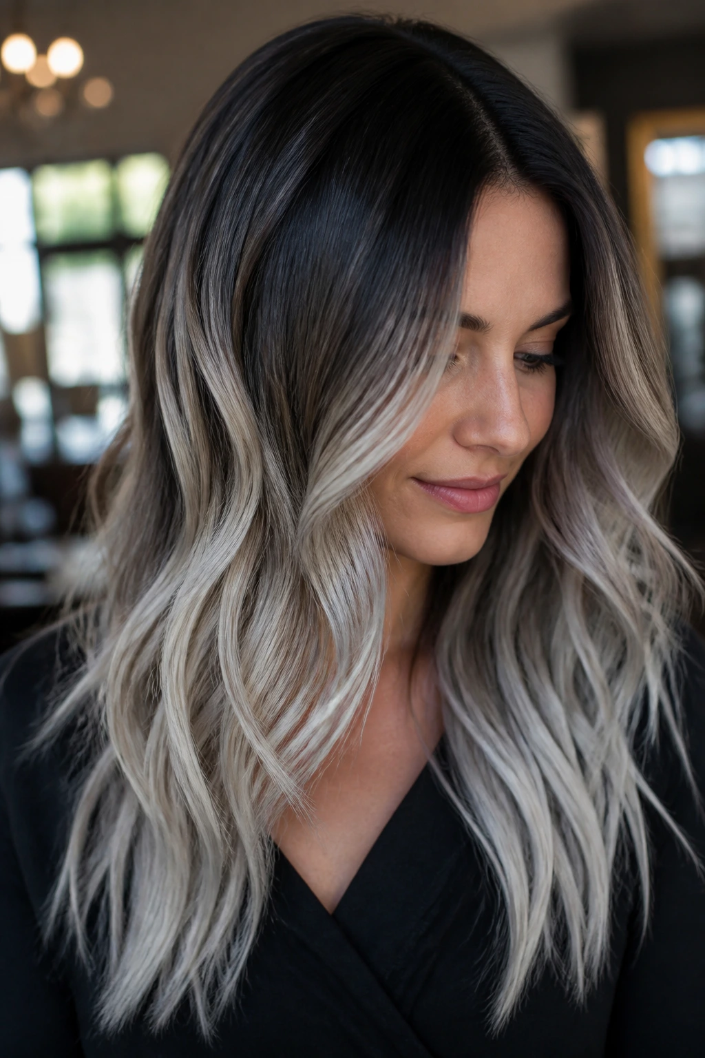 Close-up of brunette with espresso roots and icy silver ends