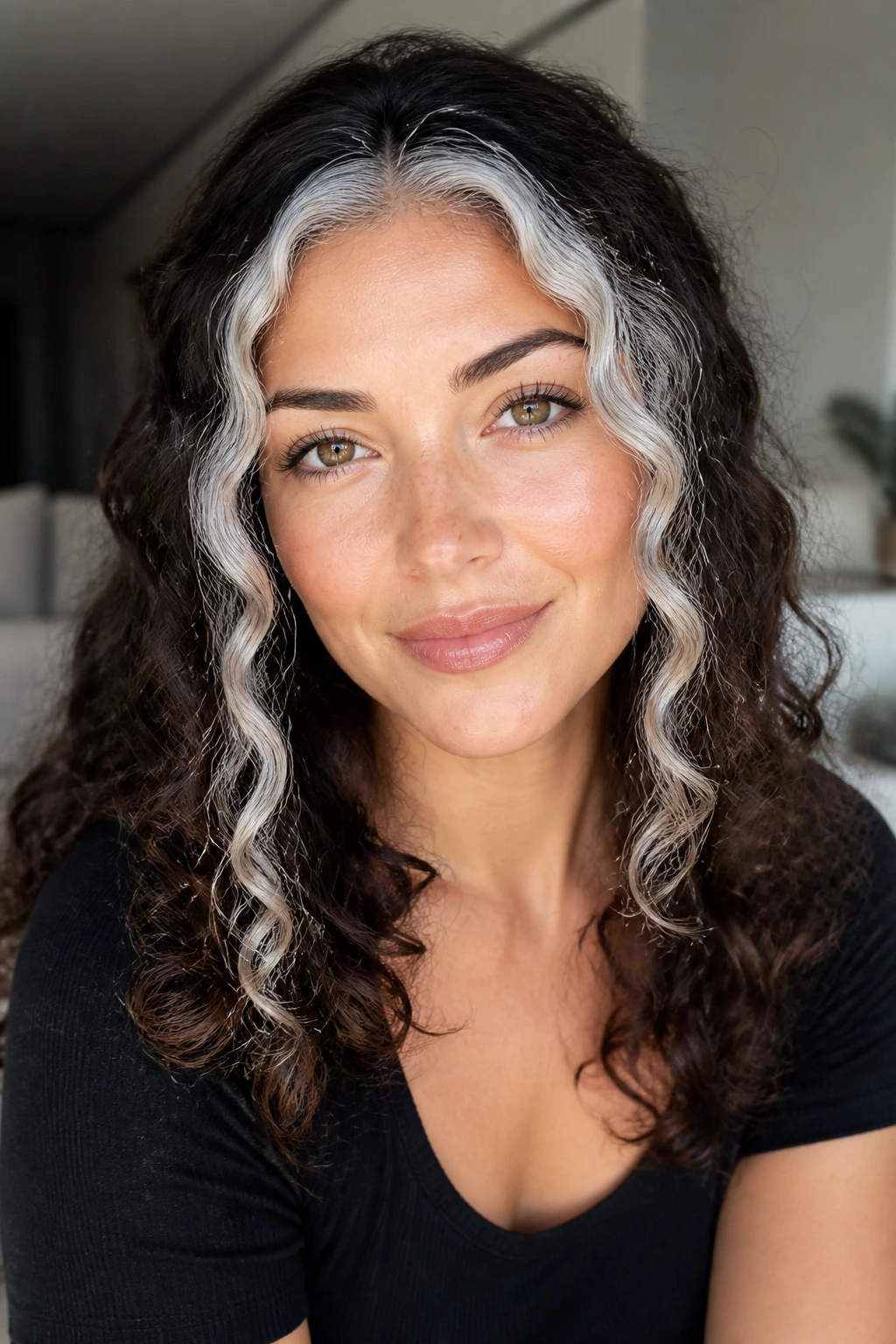 Close-up of icy silver face frame on brunette curls
