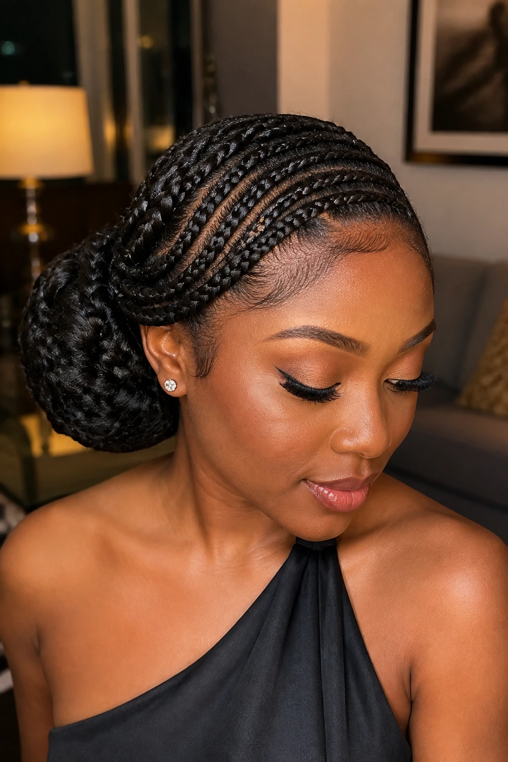 Real person with feed-in braids forming a soft side chignon