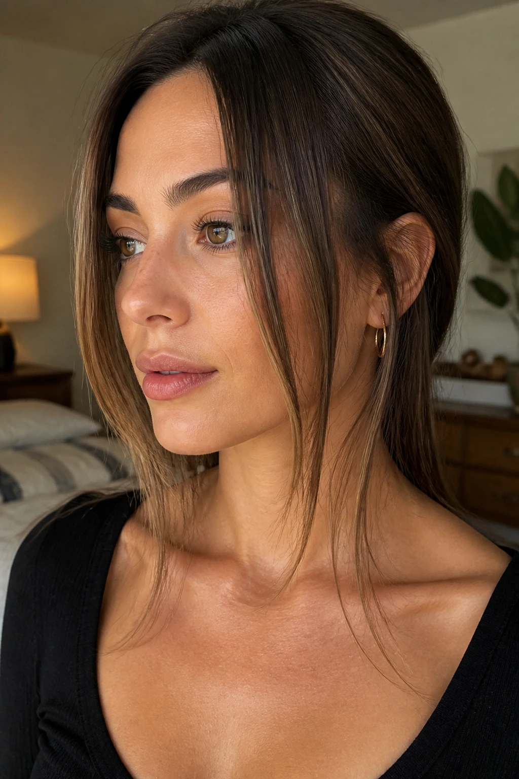 Close-up of a real woman with chin-to-collarbone frame pieces in long hair