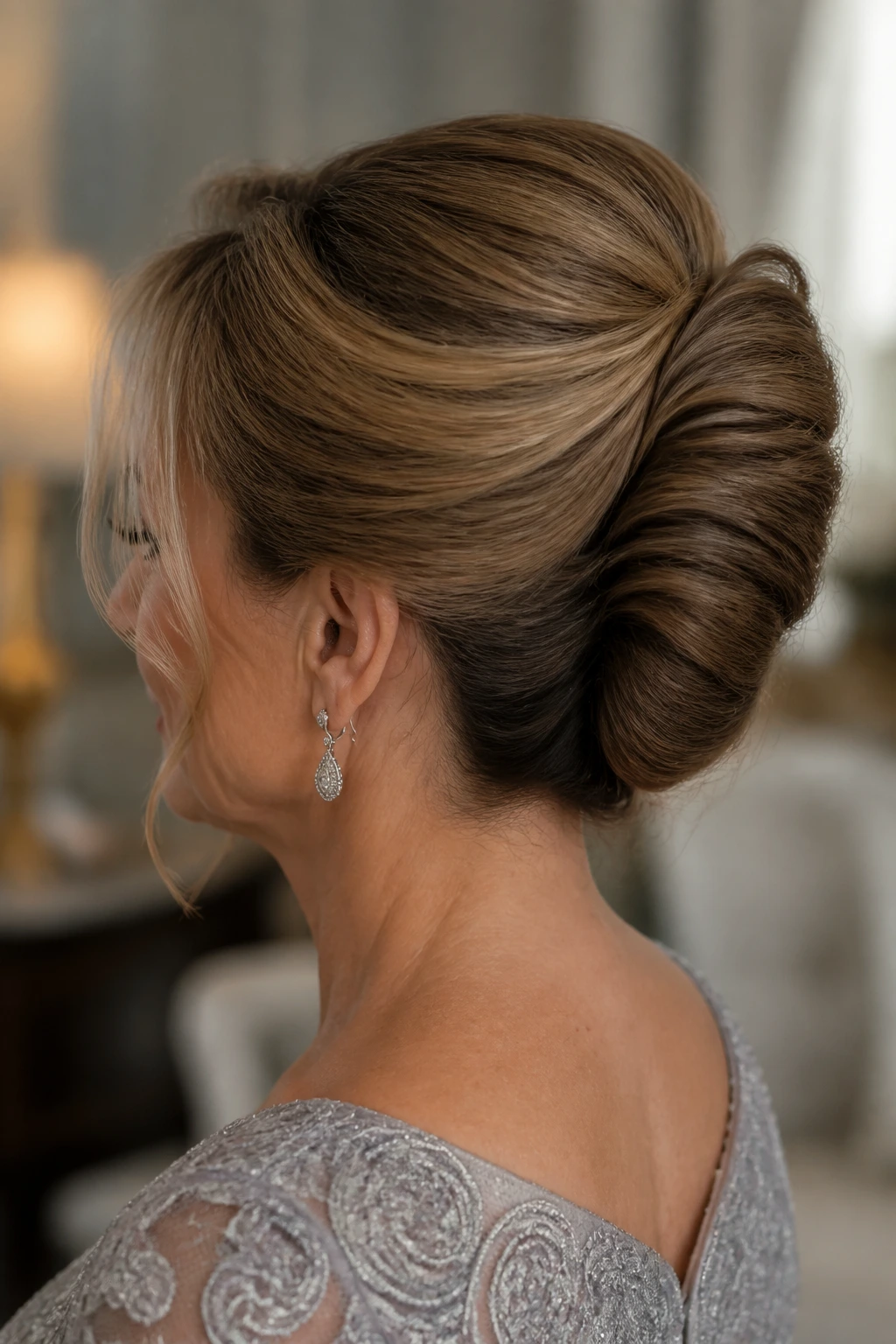 Back/side profile of woman with French twist and soft crown