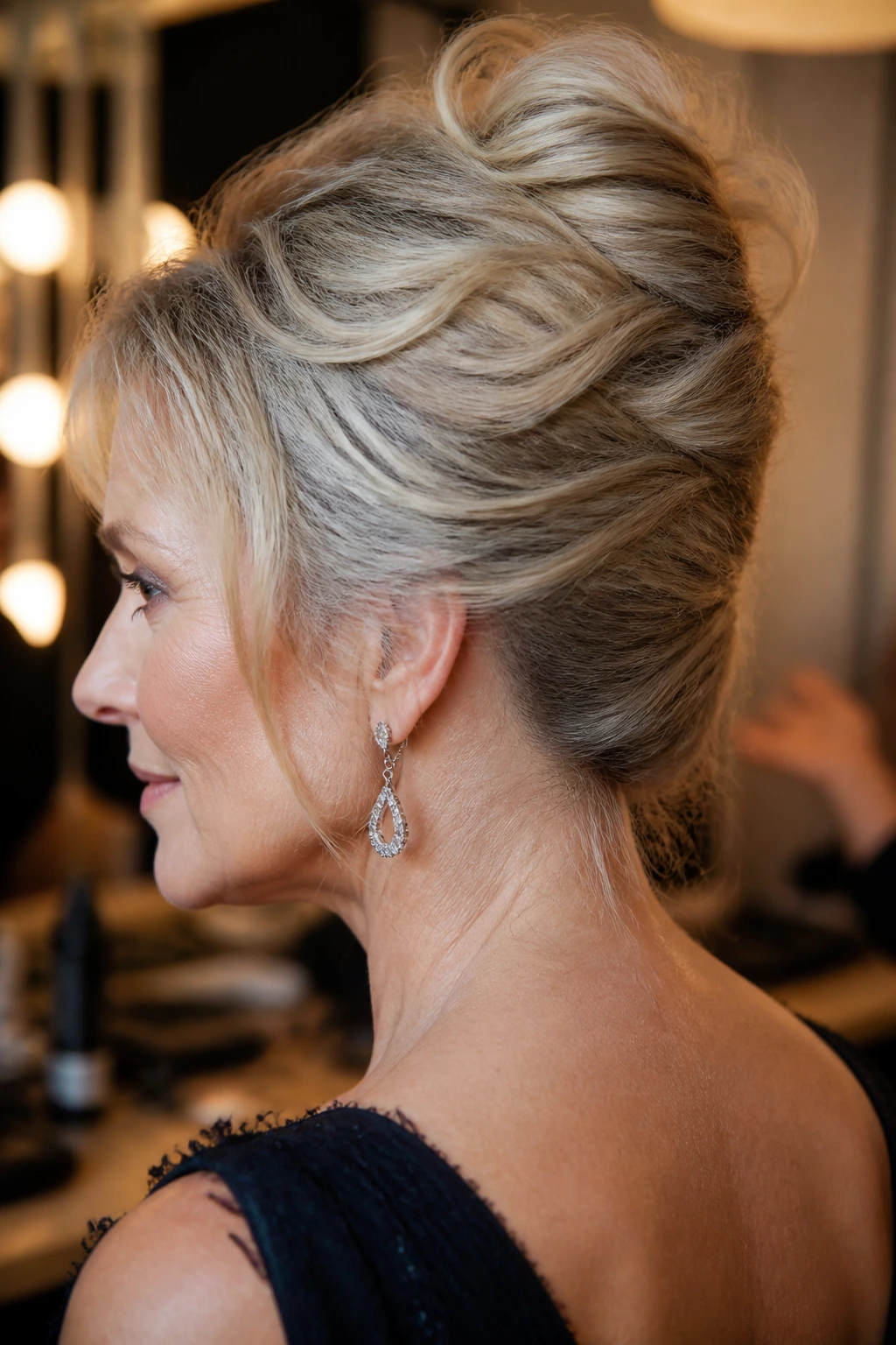 Portrait of a real woman with a soft-textured French twist.