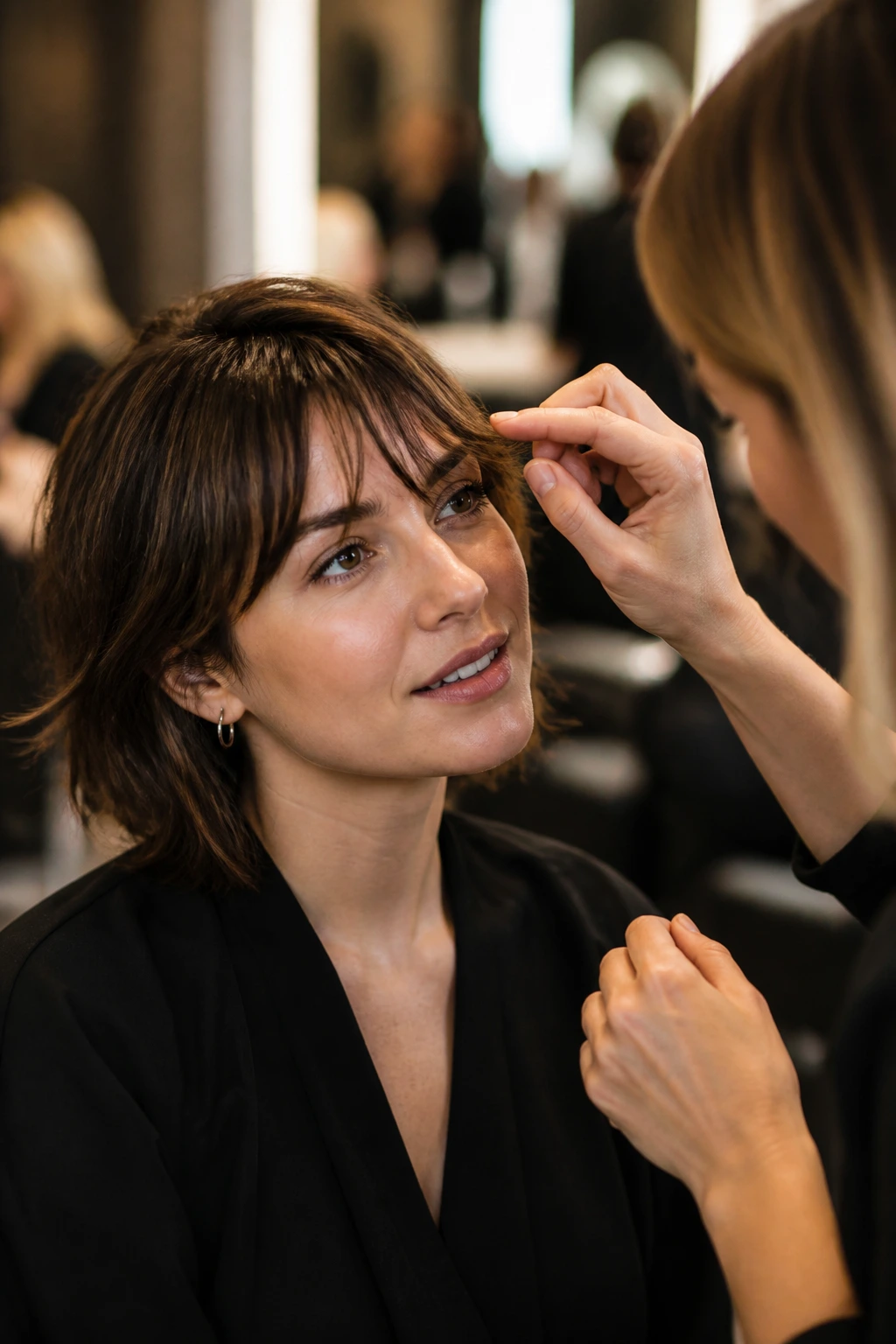 Portrait of a real person in a salon consultation about fringe length and density