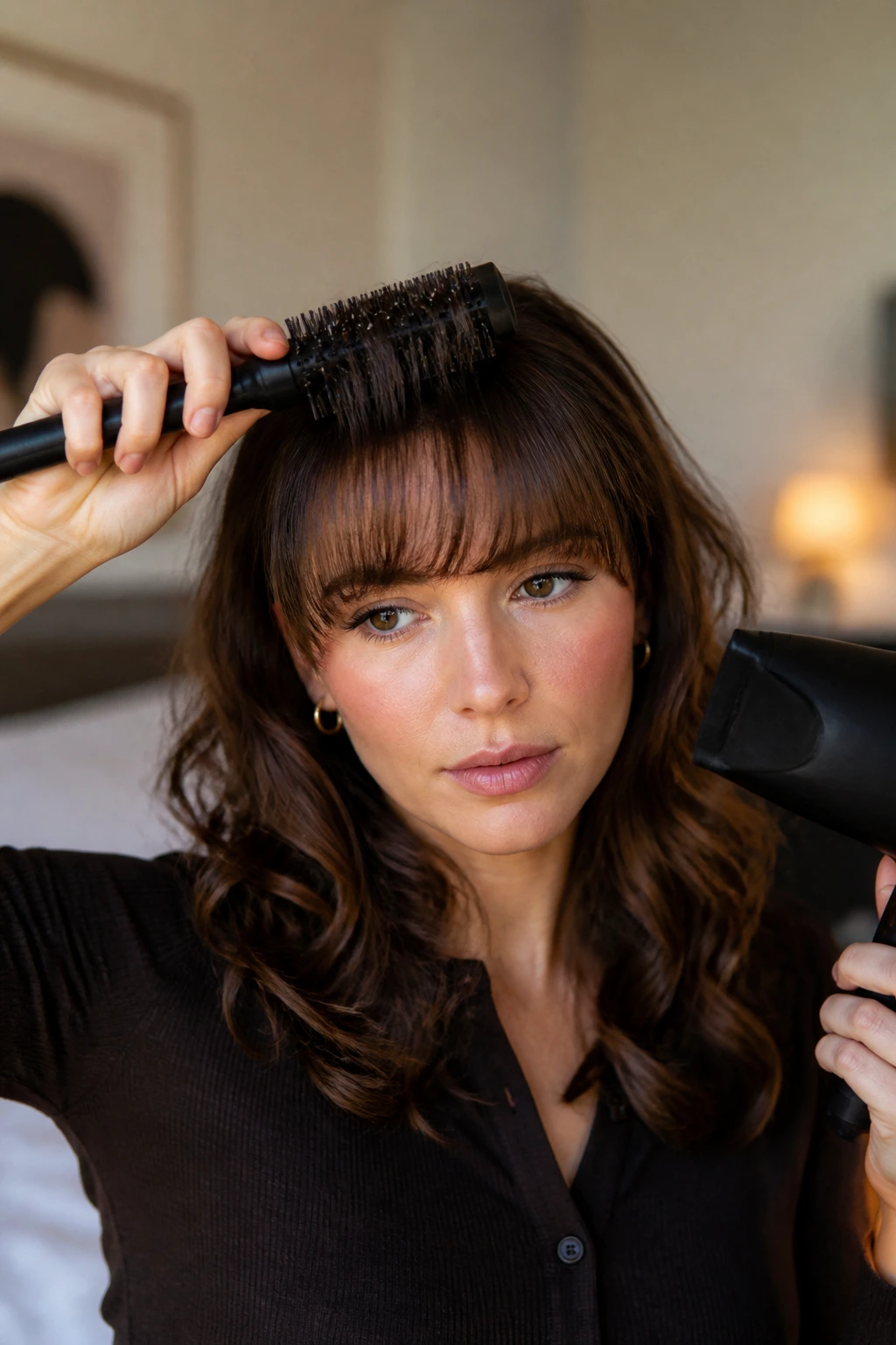 Portrait of a woman with neatly styled fringe and loose curls